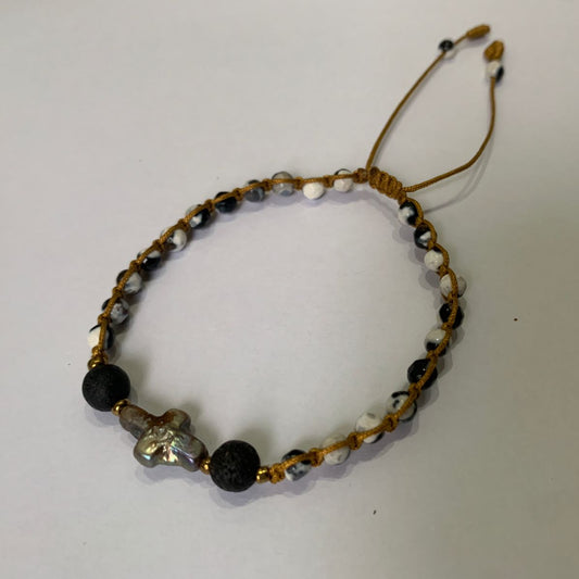 Beaded bracelet with snowflakes stone black, white, and baroque pearl Cross, and lava stone diffuser